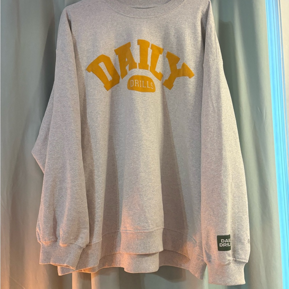 Daily Drills Gray Sweatshirt with orange letters